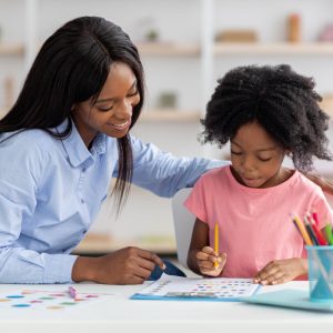 cute-african-american-little-girl-exercising-daycare cute-african-american-little-girl-exercising-daycare